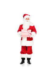 emotional santa claus holding gift box and looking at camera isolated on white