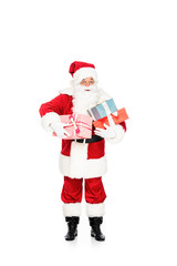 santa claus holding pile of gift boxes isolated on white