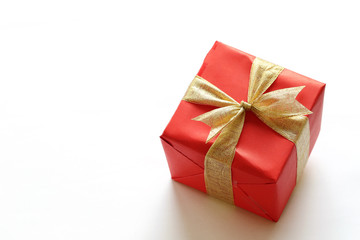 Red gift box isolated on white with close-up.