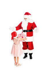 little child giving present to surprised santa claus isolated on white