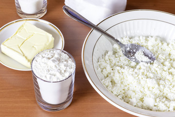A bowl full of cottage cheese, ingredients for making cookies