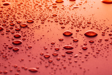 Water drops on a red background