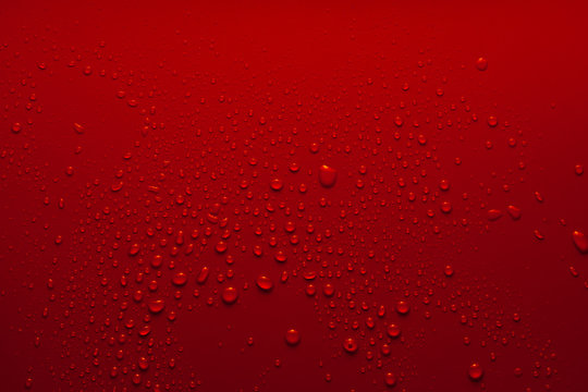 Water drops on a red background