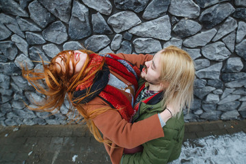 Winter holiday, dating, fashion and drive emotions concept. Happy stylish couple hot embracing in...