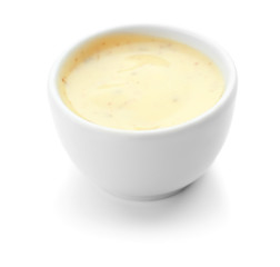 Tasty sauce in bowl on white background