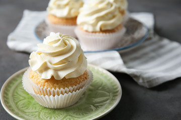 Delicious cupcake on plate
