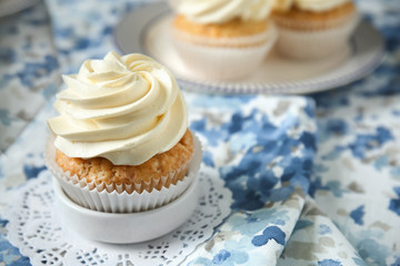 Delicious cupcake on color napkin