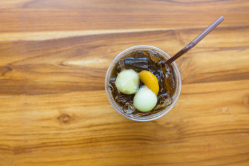 Top view of Melon ice tea with orange and melon ball.