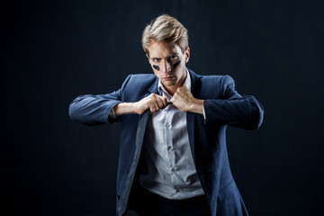 Businessman with war paint on his face. Risk management concept.