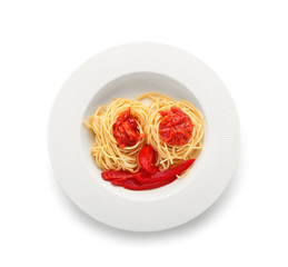 Plate with pasta, sauce and vegetables on white background