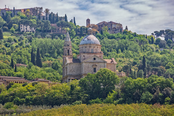 Church of the Madonna di San Biagio at the gates of Montepulciano. View of the church Madonna di San Biagio and of the hilltop town of Montepulciano in Tuscany, Italy