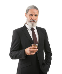 Elderly businessman with glass of whiskey on white background