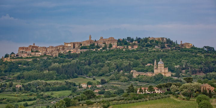The medieval village of Montepulciano. View of the church Madonna di San Biagio and of the hilltop town of Montepulciano in Tuscany, Italy