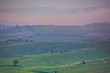 Obraz premium Tuscany landscape in the fog. Morning fog over the rolling hills of Montepulciano, Tuscany, Italy