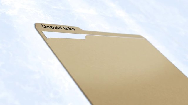 Cinematic camera slides past manila folder - Unpaid Bills