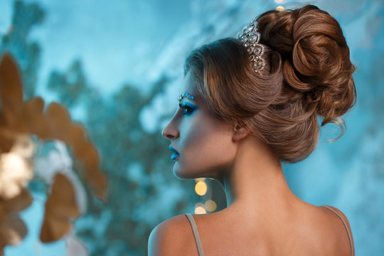 Elegant evening hairstyle view from the side.
