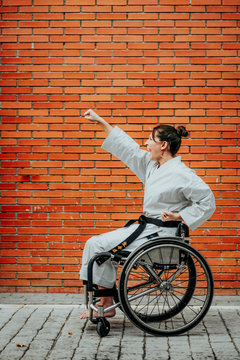 Woman who training karate with wheelchair