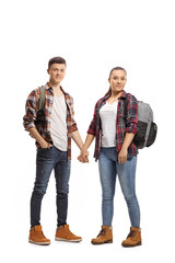 Male and female students holding hands
