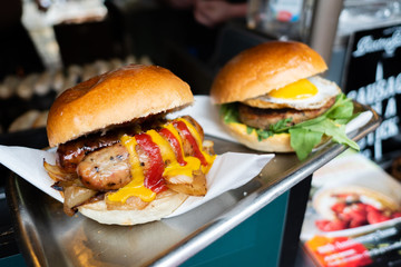 Tasty and delicious hamburger. Once branded as an American junk food and fast food, now consider as a delicacy and gourmet food. Many are made from quality beef. Healthy eating and eat well concept.