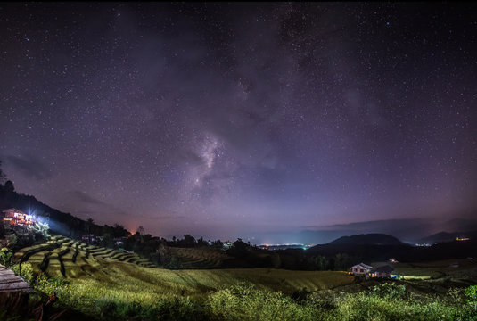 The Milky Way galaxy on the rice field on the mountain.Long exposure photograph, with grain.Image contain certain grain or noise and soft focus.
