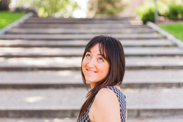 young pretty girl smiling on stairs