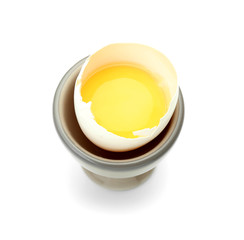 Raw chicken egg in holder on white background