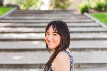 young pretty girl smiling on stairs