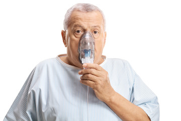 Mature male patient with an inhalation mask