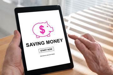 Saving money concept on a tablet
