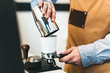 Barista preparing coffee for espresso machine