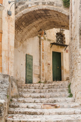 Fototapeta na wymiar Ancient town of Matera (Sassi di Matera), European Capital of Culture 2019, Basilicata, Southern Italy. Narrow street