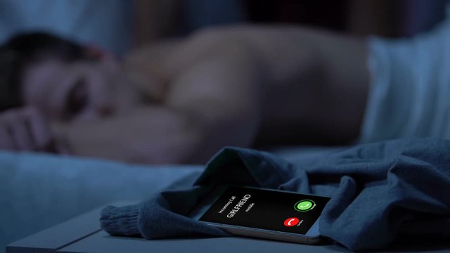 Girlfriend incoming call, male cheating on her with another woman, betrayal