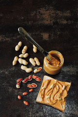 Peanut butter in a jar. Peanut Butter Toast Peanuts in the shell. Energy breakfast concept. Vegan snack.
