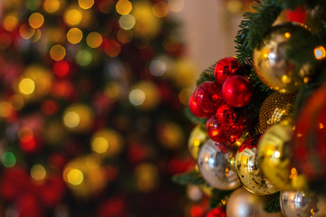 Fototapeta na wymiar Christmas balls and ribbon on the background of the Christmas tree