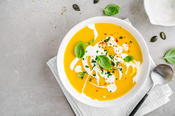 Pumpkin creamy soup served in bowl - obrazy, fototapety, plakaty