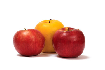 Three ripe apples on a white isolated background.