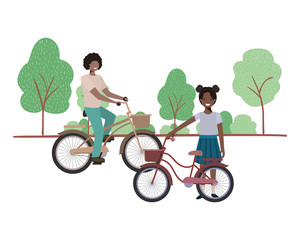 father and daughter with bycicle in landscape