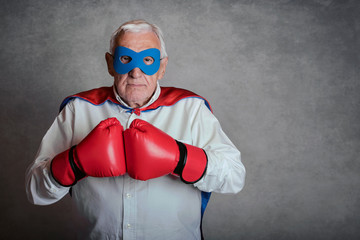 Super grandpa, senior man dressed as a superhero