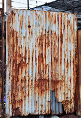 Old rusty galvanized, corrugated iron siding vintage texture background of grunge.