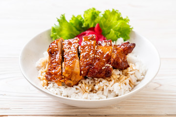 grilled chicken with teriyaki sauce on topped rice