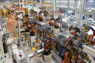 body of car on conveyor top view. Modern Assembly of cars at the plant. The automated build process...