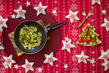 Christmas dinner lunch healthy food on red tablecloth with vegetables