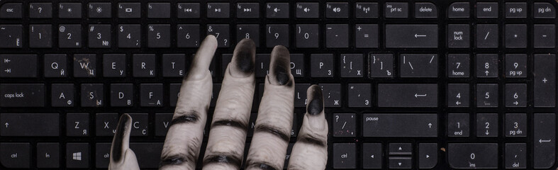 monster hand on keyboard