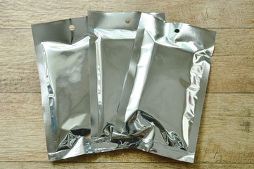snack package aluminum foil mock-up arranging on table