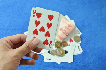 hand holding nine in baccarat games