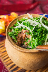 Lobio - traditional Georgian dish with red beans, cilantro, ajika spice served with pickles vegetables. Vegan vegetarian healthy food