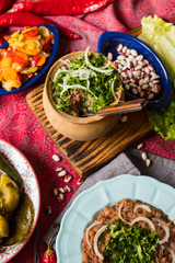 Lobio - traditional Georgian dish with red beans, cilantro, ajika spice served with pickles vegetables. Vegan vegetarian healthy food