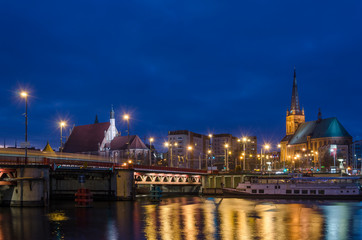 Fototapeta na wymiar CITYSCAPE - Szczecin by night on banks of the river