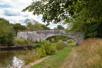 White washed arch bridge in the countryside, Cheshire UK