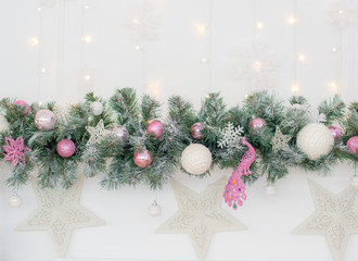 Decorated in a pink Christmas tree on a blurred, sparkling and fabulous background.